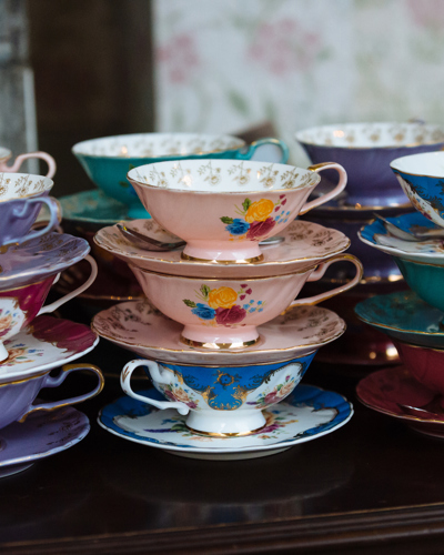 stacked china tea cups with floral patterns