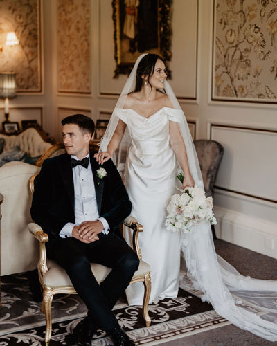 Bride and groom pose for photos inside ballyseede castle estate in kerry