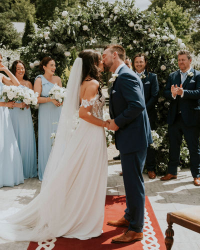 A kiss at the altar on the bride and grooms special day at ballyseede castle wedding venue