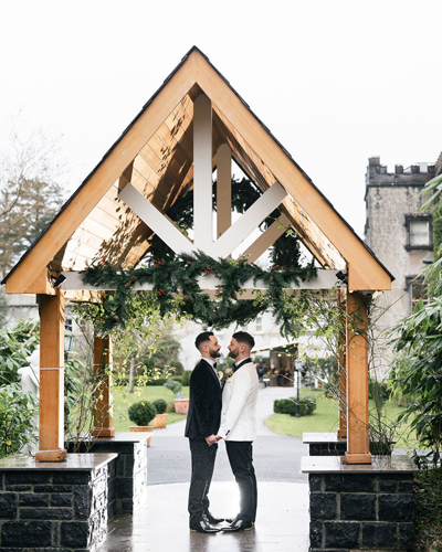 Couple embrace at Ballyseede castle on their wedding day